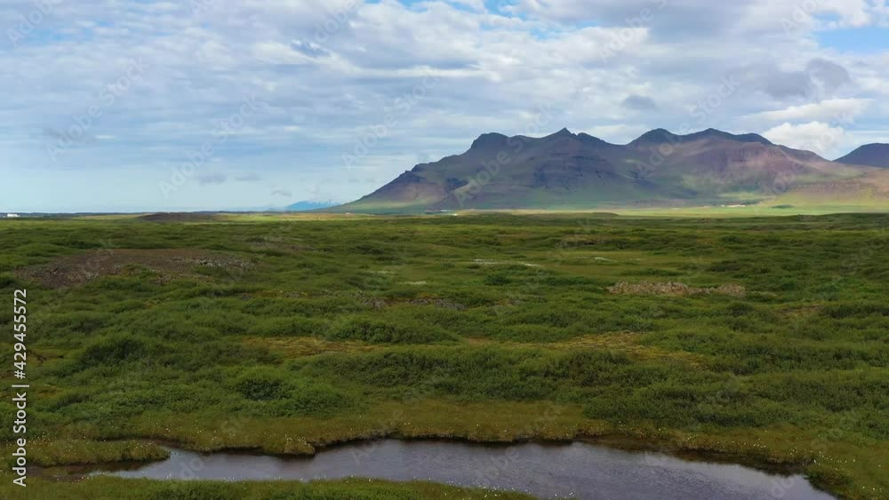 Iceland. Aerial view on the mountain, field and lake. Landscape in the Iceland at the day time. Landscape from drone. Travel and vacation video Iceland. Aerial view on the mountain, field and lake. Landscape in the Iceland at the day time. Landscape from drone. Travel and vacation video