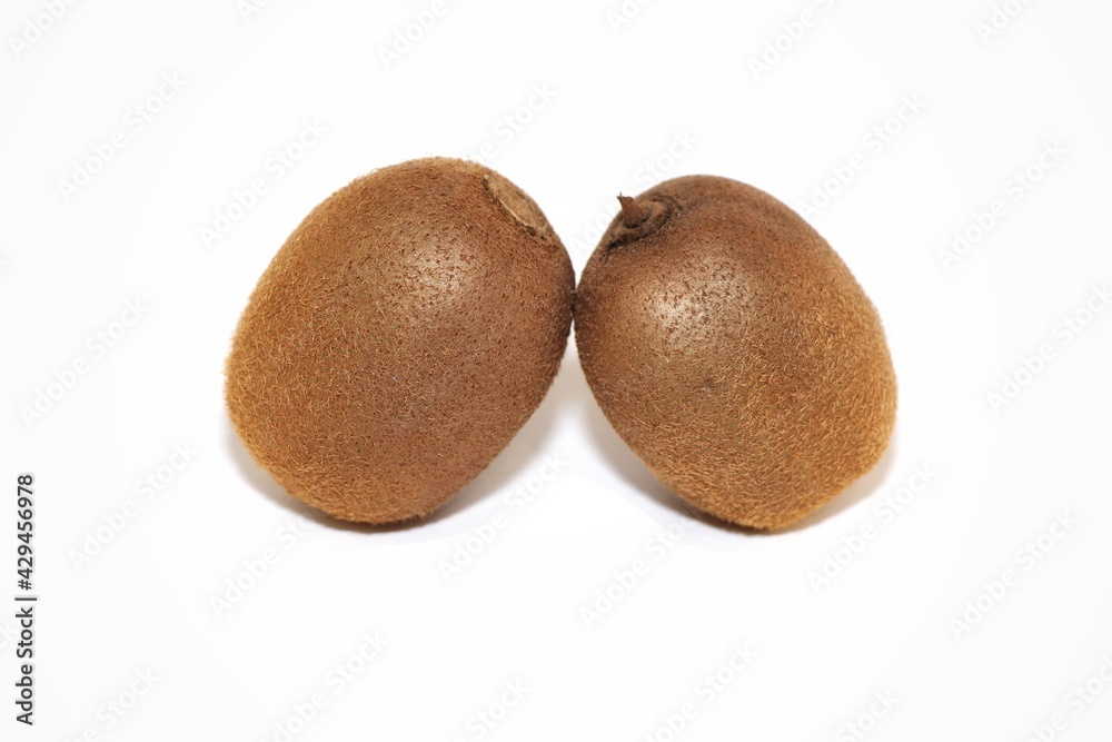 Slice of kiwi and whole kiwi on a white isolated background
