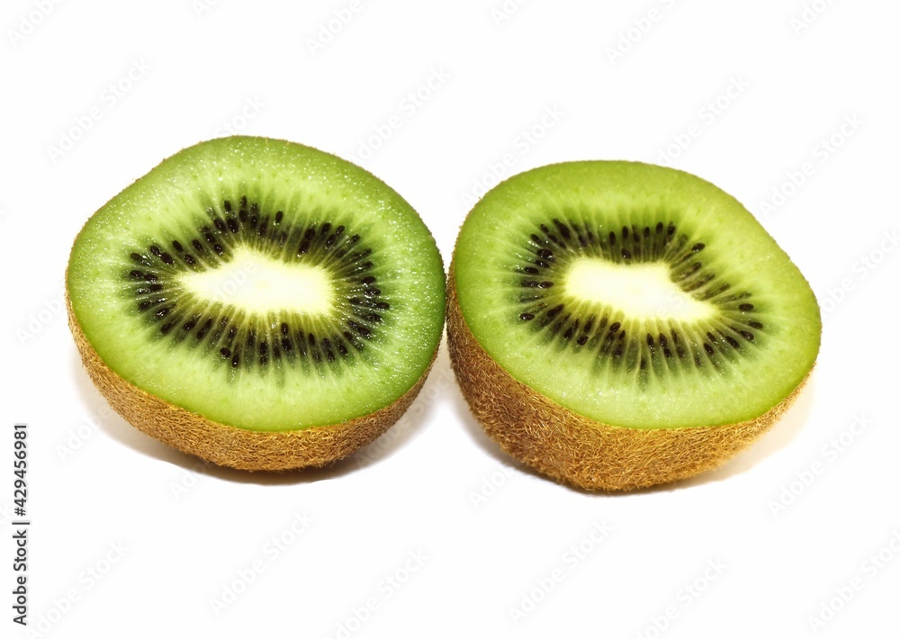 Slice of kiwi and whole kiwi on a white isolated background Slice of kiwi and whole kiwi on a white isolated background