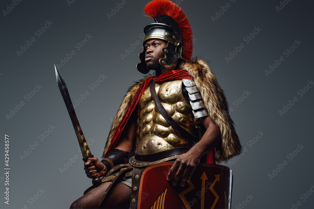 Naklejka premium Roman warrior with pelt wielding sword and shield