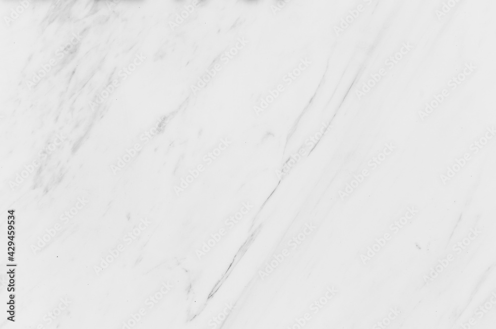 The surface of natural stone beige and white shades. White Carara marble texture background. The surface of natural stone beige and white shades. White Carara marble texture background.