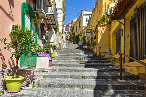 Fototapeta Naklejka Na Ścianę i Meble -  A narrow street between old buildings in the city of Naples in Italy.