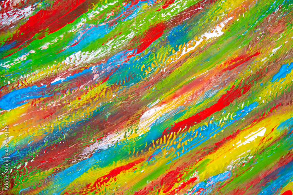 Background from different strokes of red, yellow, green and blue paint