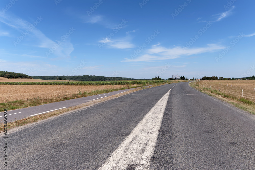 Country road in Ile-De-France region. Moigny-sur-École village