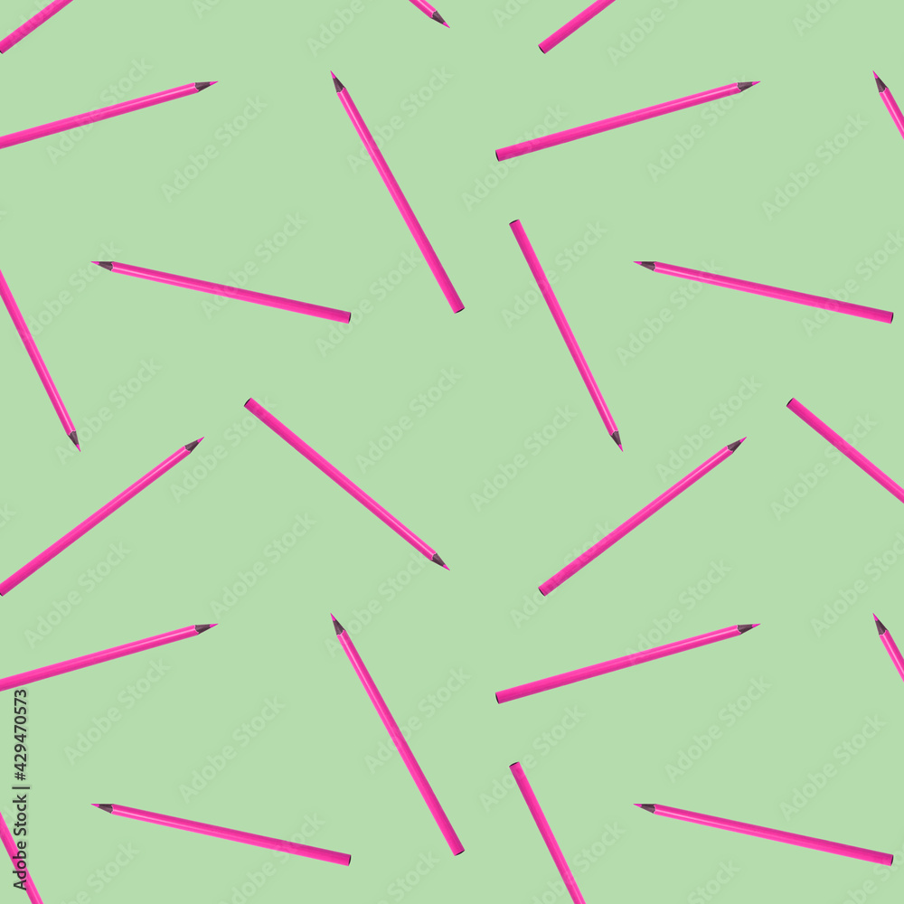 Seamless pattern with pink pencils on light green background. Geometry education concept background. Textile print design. Seamless pattern with pink pencils on light green background. Geometry education concept background. Textile print design.