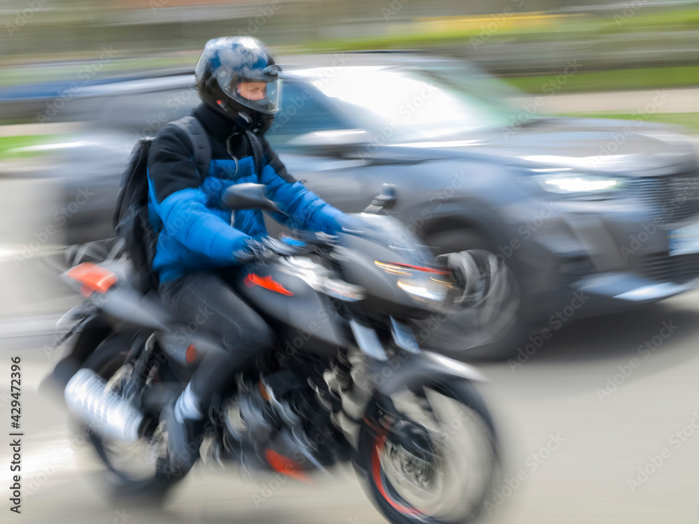 Blurred image of a motorcyclist