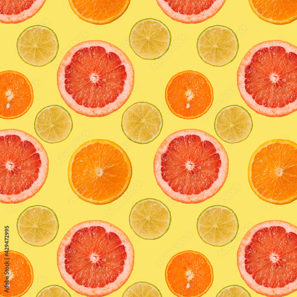 Summer Seamless pattern of juicy Orange grapefruit manadarine tangerine lime Fruit slice on yellow background. Healthy food lifestile. fruit juice advertising. Summer rest concept. Summer Seamless pattern of juicy Orange grapefruit manadarine tangerine lime Fruit slice on yellow background. Healthy food lifestile. fruit juice advertising. Summer rest concept.