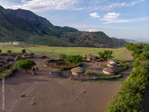 Aerial Drone Shot. Traditional Masai village at Sunset time near Arusha, Tanzania photo