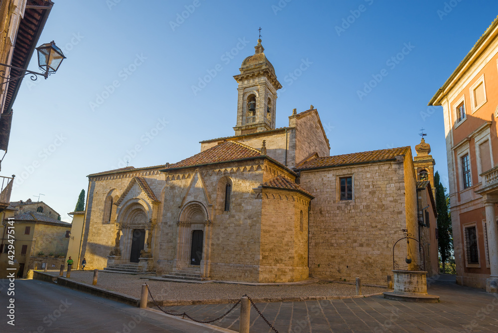 Medieval cathedral La Collegiata dei Santi Quirico e Giulitta on a sunny evening, Italy