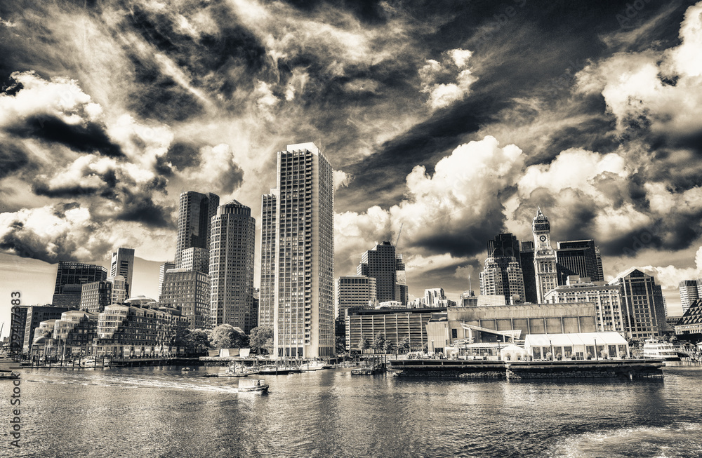 Boston Waterfront skyline. City buildings at sunset seen from Fort Point Channel