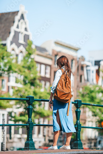 Happy young woman in european city