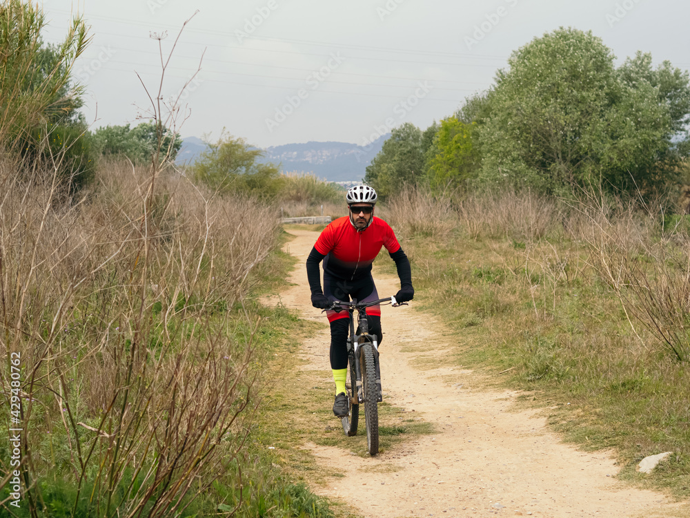 Cyclist man with a mountain bike during a competition Cyclist man with a mountain bike during a competition