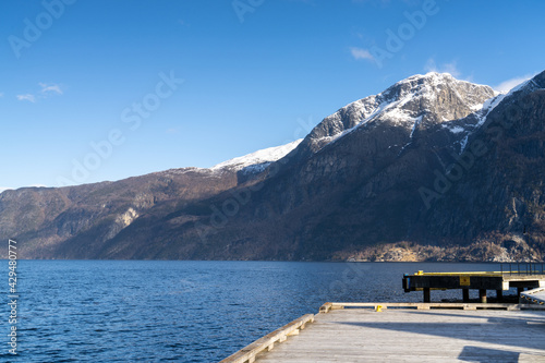 Eidfjord, a Norwegian town and municipality in the Hordaland region, view from the beach on the Eidfjorden, the inner branch of the large Hardangerfjorden in Scandinavia