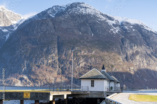 Eidfjord, a Norwegian town and municipality in the Hordaland region, view from the beach on the Eidfjorden,  the inner branch of the large Hardangerfjorden in Scandinavia photo