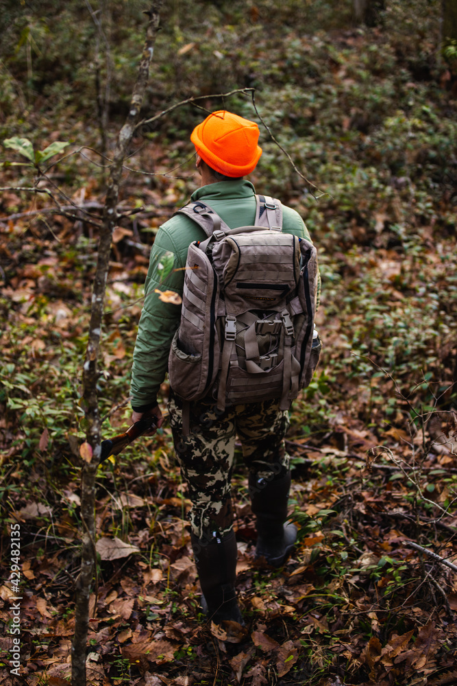 Naklejka premium Man Hunting in forest