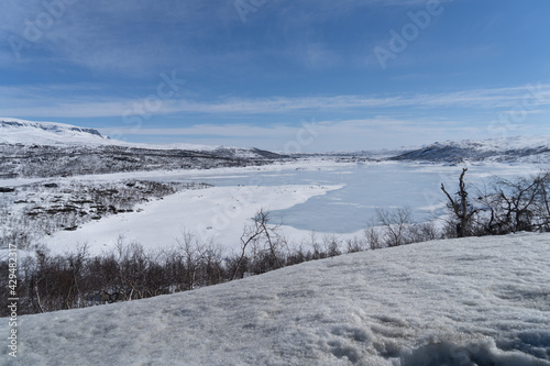 View of the frozen lake Sløddfjorden near the village of Haugastøl, in the municipality of Hol, Viken County, Norway, Scandinavia © Dreamnordno