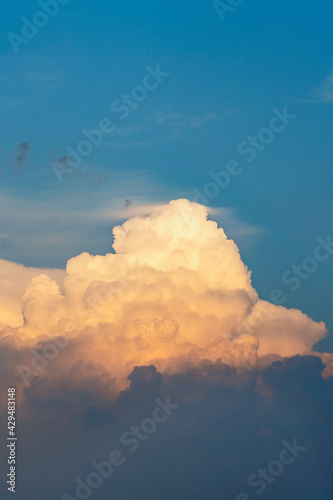 evening sky with beautiful sunlit clouds as a natural background
