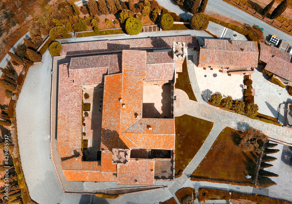 Aerial view of Banfi Castle from drone in Tuscany, spring season