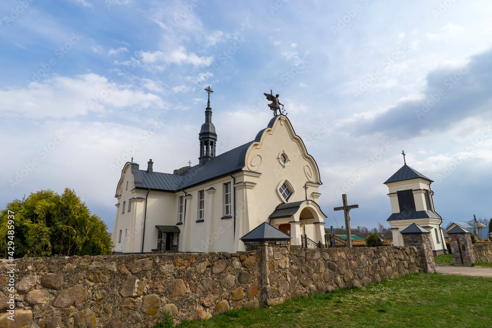 Fototapeta premium The Church of St. Michael the Archangel in the village of Bogdanovo, built in the 20th century in the Art Nouveau style.