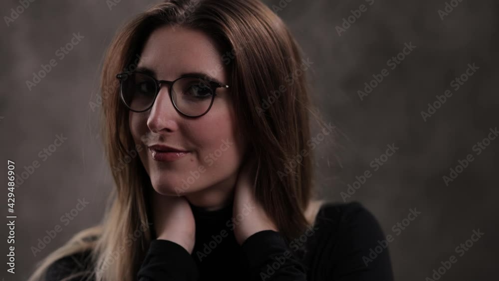 Photo shooting with a young attractive woman in a studio - studio photography Photo shooting with a young attractive woman in a studio - studio photography