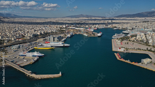 Aerial drone panoramic photo of famous and busy port of Piraeus where passenger ships travel to popular Aegean destinations, Attica, Greece © aerial-drone