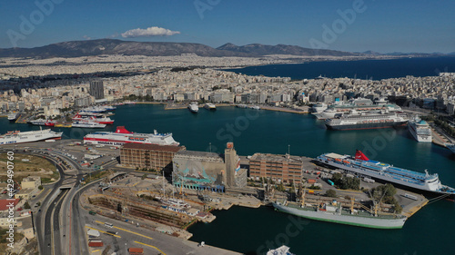 Aerial drone panoramic photo of famous and busy port of Piraeus where passenger ships travel to popular Aegean destinations, Attica, Greece photo