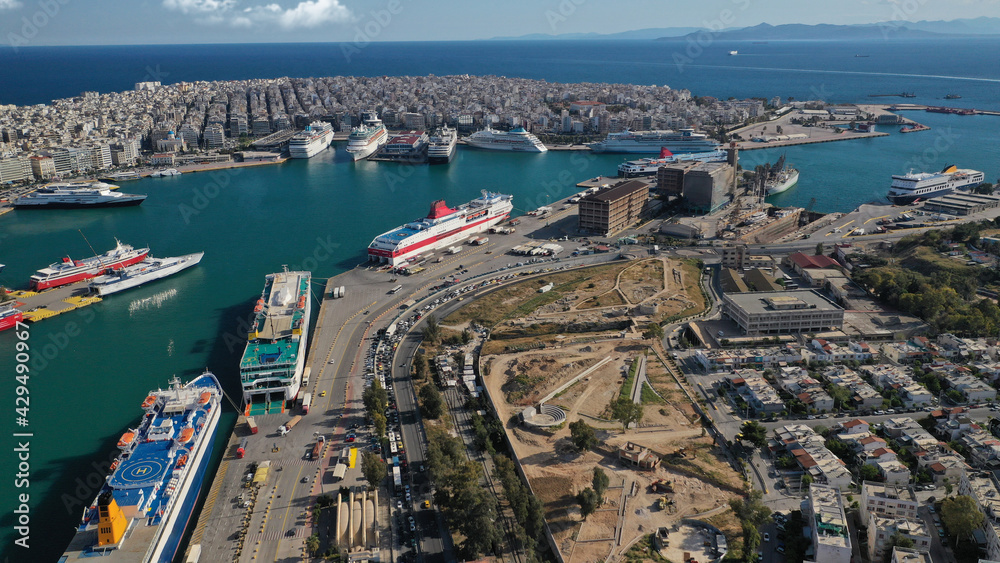 Aerial drone photo of iconic busy port of Piraeus and archaeological site - Ruins of the Eetioneia , ancient walls of Piraeus, Attica, Greece