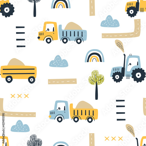 Seamless pattern with cute cars, tractor and decorative elements on a white background. Vector illustration for printing on fabric, packaging paper, clothing. Cute baby background for boys