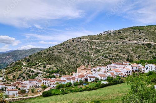View of white village with mountains to the rear  Alpandeire  Serrania de Ronda  Malaga province  Andalusia  Spain.