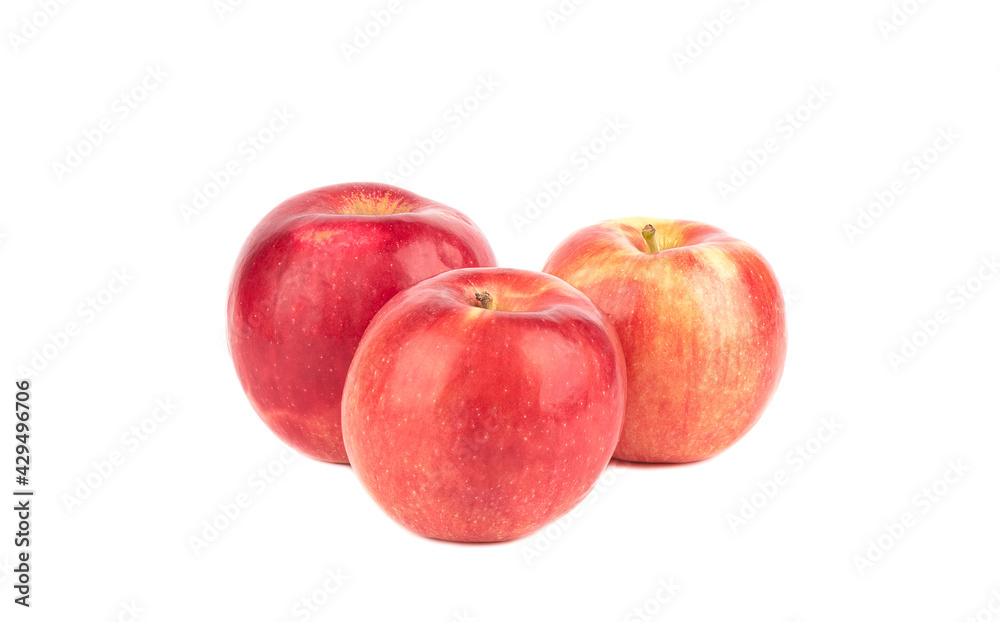 Three red apples isolated on a white background.