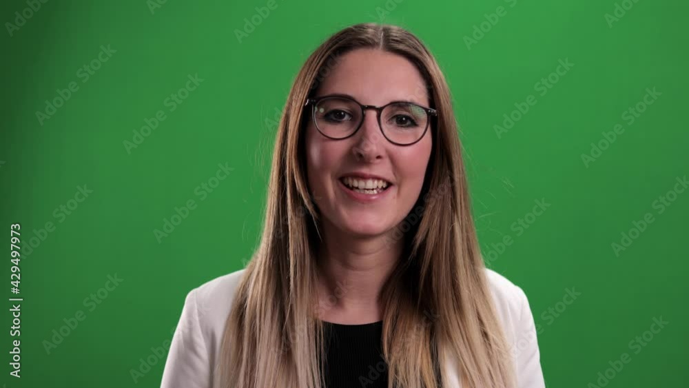 Young woman speaks to the camera in a video conference call - green screen shot Young woman speaks to the camera in a video conference call - green screen shot