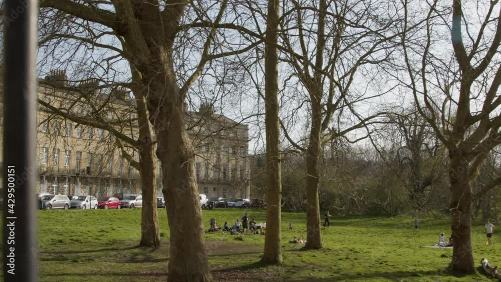 Tracking Shot of Pedestrians On Green Space Near Norfolk Crescent Tracking Shot of Pedestrians On Green Space Near Norfolk Crescent