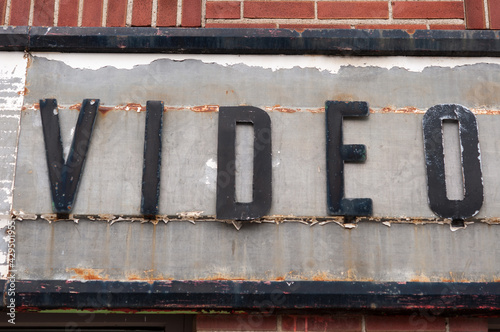 vintage sign of a former video sales and rental shop photo