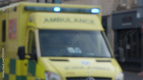 Defocused Medium Shot of Stationary Ambulance  photo