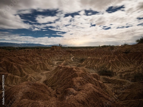 Night time panorama of Tatacoa desert tropical red sand stone labyrinth in Villavieja Neiva Huila Colombia South America photo