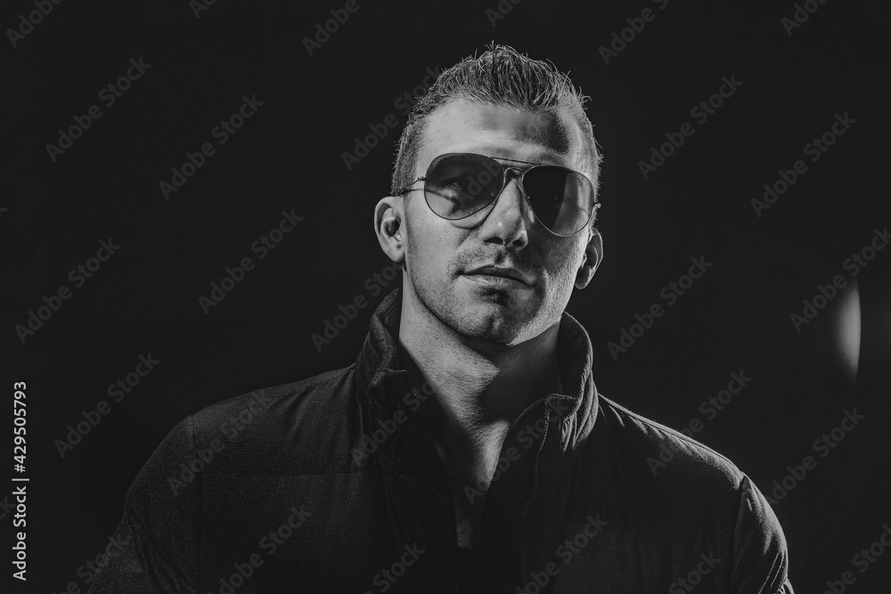 Obraz premium Black and White Brutal confident strong beautiful male model in