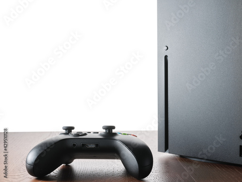 Gamepad and console on table with isolated background
