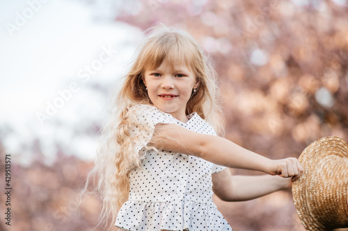 portrait of a little girl in the park photo