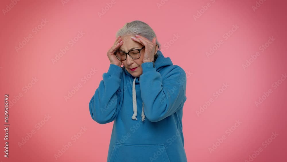 Upset elderly granny woman wish, waiting for good luck and loses becoming surprised sudden lottery results, bad fortune, loss. Senior old grandmother isolated on pink wall background. People emotions Upset elderly granny woman wish, waiting for good luck and loses becoming surprised sudden lottery results, bad fortune, loss. Senior old grandmother isolated on pink wall background. People emotions