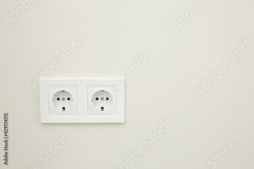 White double socket on white background.Electric plug. European high voltage 220W sockets.High resolution photo.