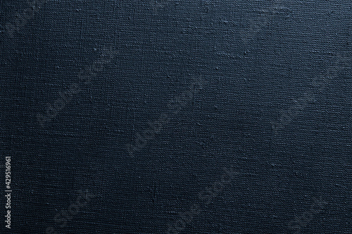 dark creative background: black primed linen canvas, uneven lighting, color toning © BUSLIQ