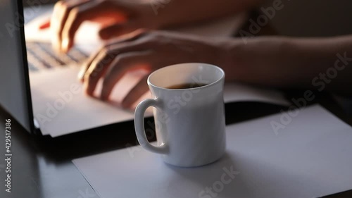 coffee and laptop. Coffee cup. Laptop. Wokring. Man. 