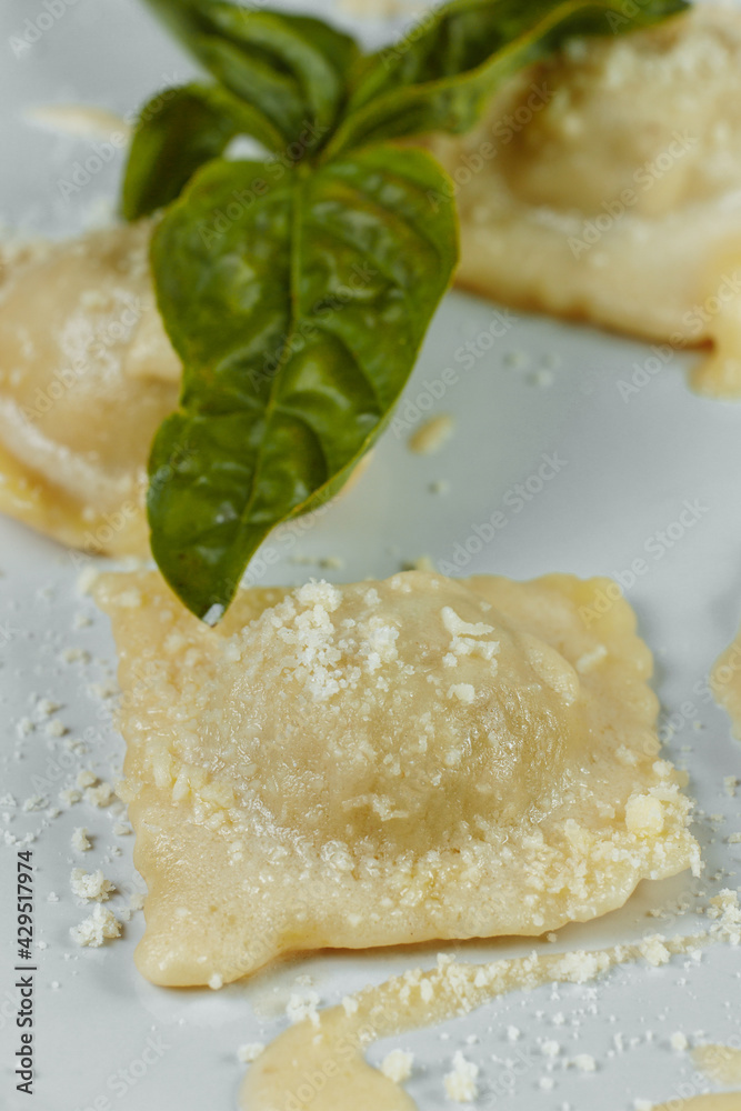 pasta ravioli with meat, tomato and basil