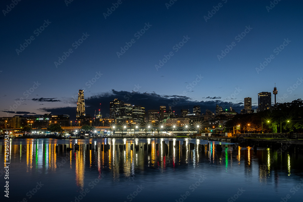Sydney fish market and city skyline at dawn