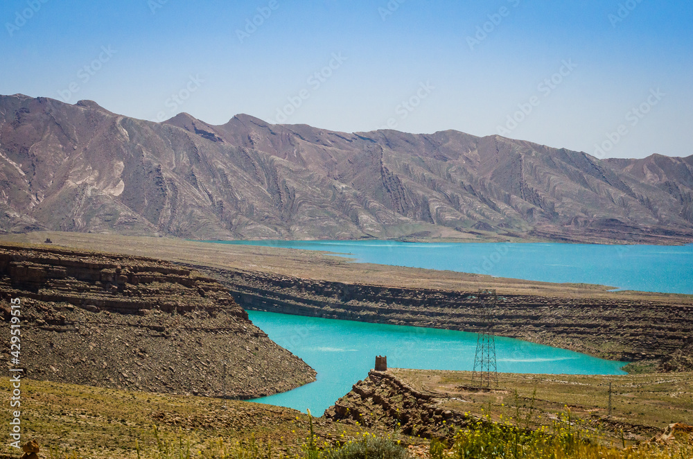 Turquoise blue water in Barrage Al-Hassan Addakhil in dry nature near Errachidia in Morocco Turquoise blue water in Barrage Al-Hassan Addakhil in dry nature near Errachidia in Morocco
