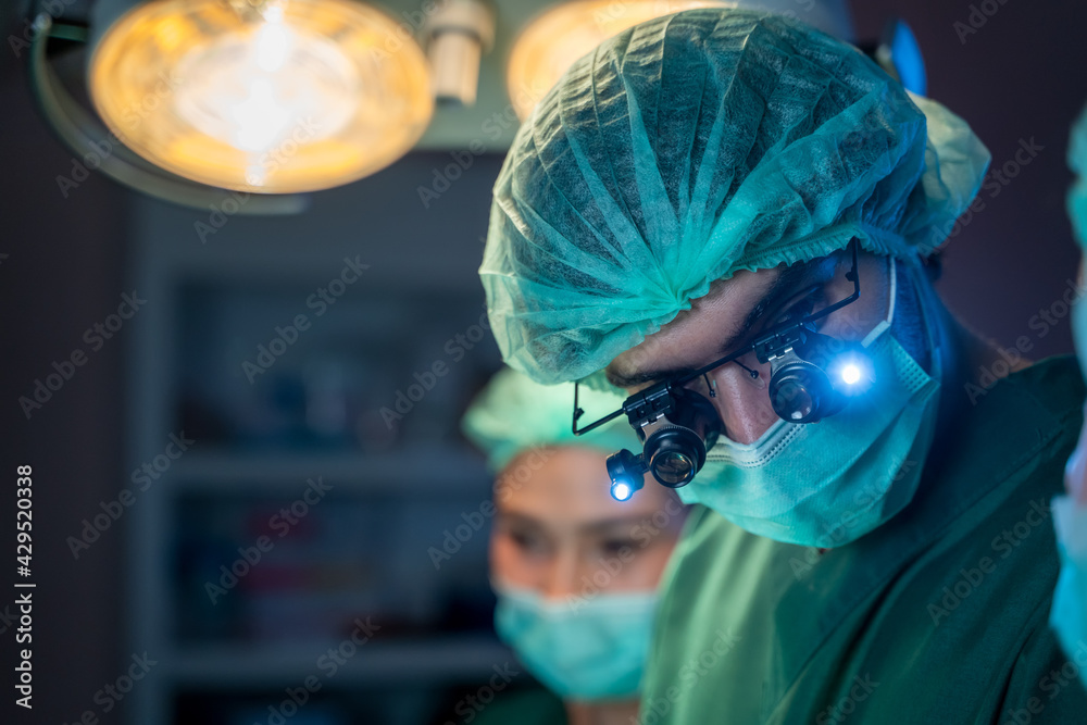 Medical team of surgeons in hospital working with electrocautery equipment for cardiovascular emergency surgery center. Medical team of surgeons in hospital working with electrocautery equipment for cardiovascular emergency surgery center.
