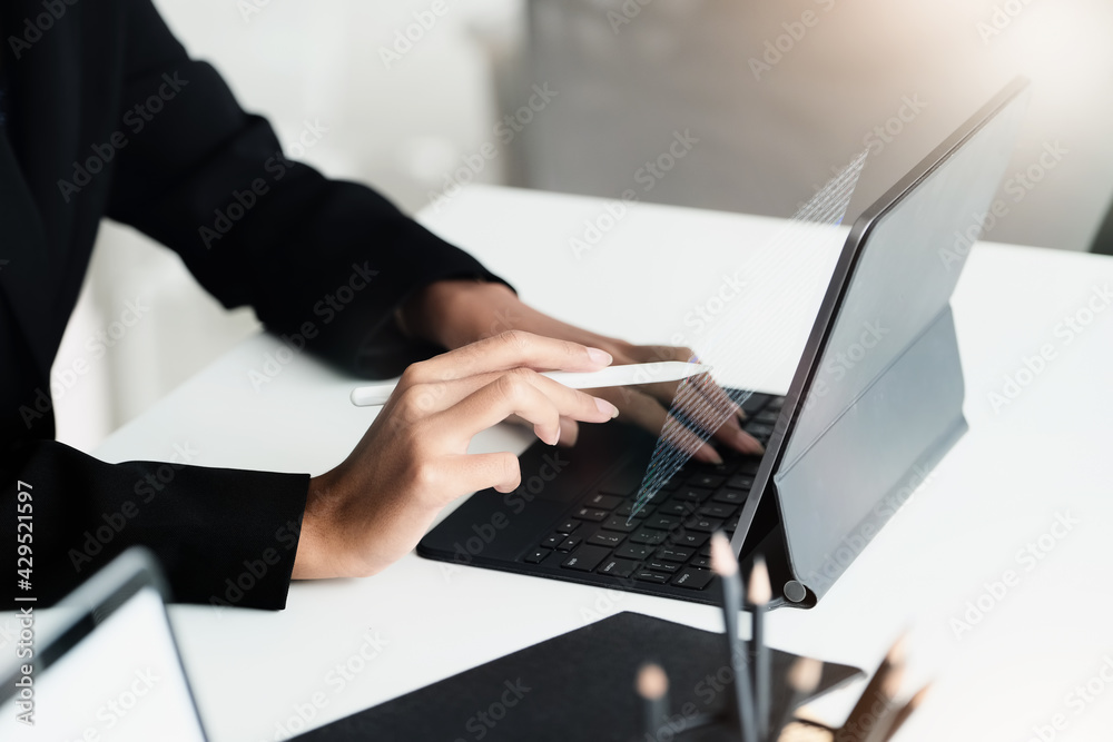 digital technology, Business woman using tablet to trade charts to find buy and sell points for her port. digital technology, Business woman using tablet to trade charts to find buy and sell points for her port.