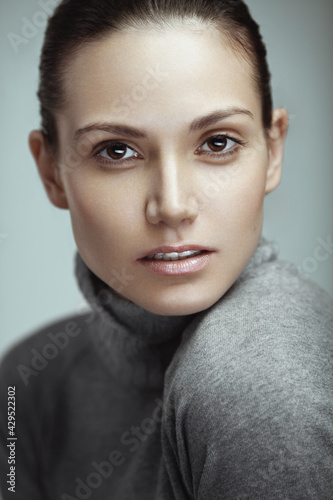 Closeup beauty portrait of a young beautiful woman. Natural makeup. Perfect fresh skin.