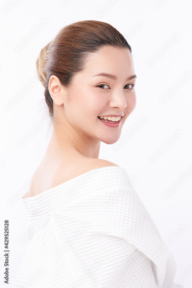 Beautiful young Asian woman wearing bathrobe on white background, Face care, Facial treatment, Cosmetology, beauty and spa Concept. Beautiful young Asian woman wearing bathrobe on white background, Face care, Facial treatment, Cosmetology, beauty and spa Concept.