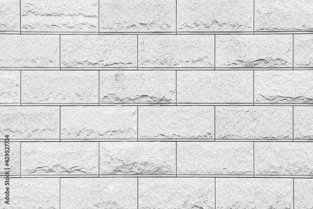 Naklejka premium Exterior White Granite Block Stone Wall texture and background seamless